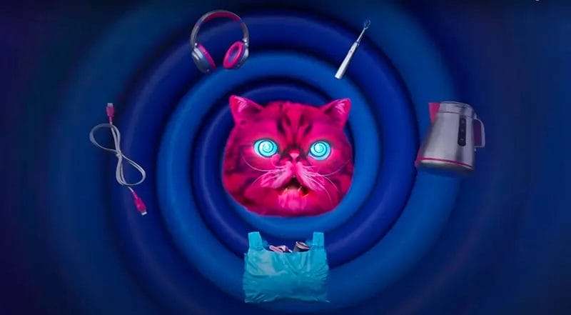 ‘HypnoCat’ (a magenta-coloured Persian cat with blue spiral eyes) surrounded by floating electricals in his TV advert