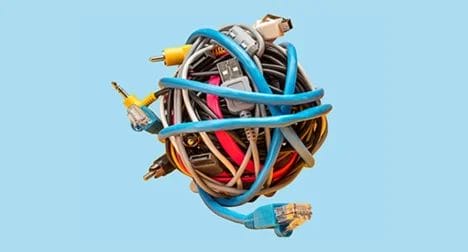 Photo shows a circular bundle of domestic cables, cutout on blue background