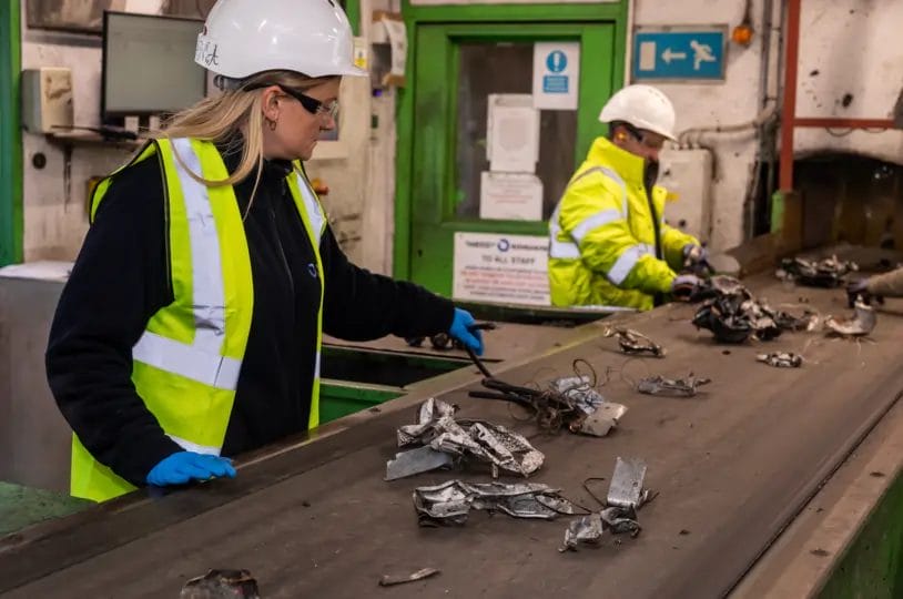 Kamila, a worker at SWEEEP electrical recycling plant, on the picking line making sure the electricals are safe for recycling